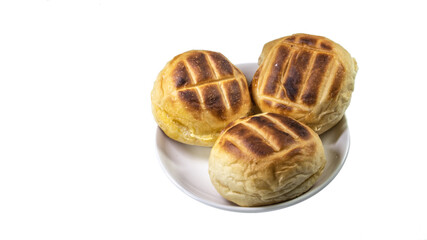 Round bun charcoal grilled serve with crispy bread skin, isolated on the white background.