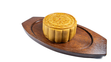 Mooncake, mid autumn festival cake on the wooden dish isolated on white background.