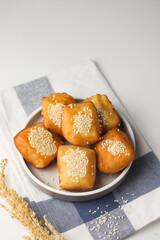 Odading or roti goreng or kue bantal, Indonesian popular traditional fried bread from Bandung, made from bread dough with sesame seed and fry, sweet flavour.