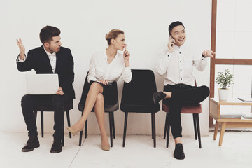  A man talks loudly while sitting in the office.