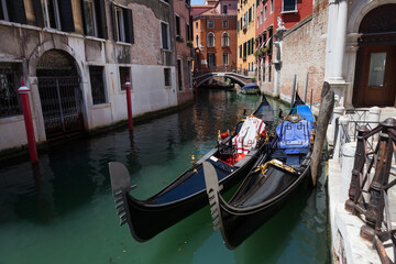 Fototapeta na wymiar Gandolas at the canal of Venice, Italy