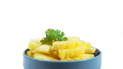 pineapple sliced serve on the blue bowl, closeup photoshoot & isolated on the white background.