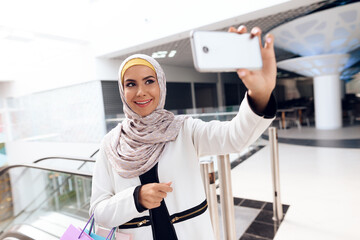 Young Arabian Woman Taking Selfie in Modern Mall.