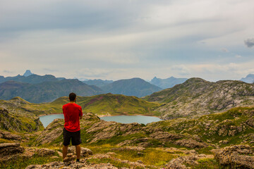 Fototapeta premium Mountain boy near Aguas Tuertas and Ibon De Estanes, Pyrenees, Spain