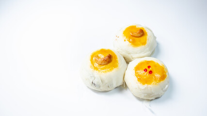 Chinese red beans pastry topping with cashew nut on the white background.