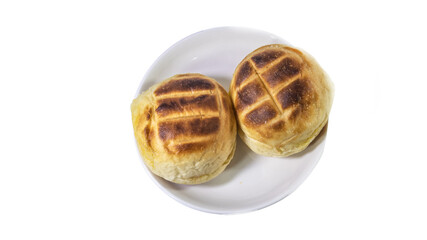 Round bun charcoal grilled serve with crispy bread skin, isolated on the white background.