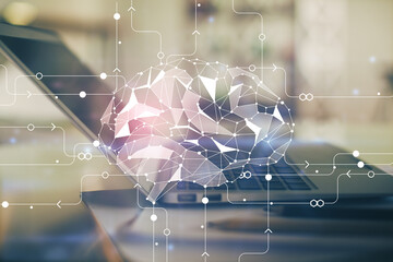 Double exposure of desktop with computer and brain drawing hologram. Artificial intelligence...