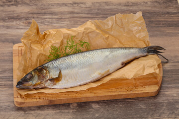 Salted herring over the wooden board