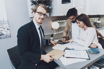 Customers sit at table and select new materials.