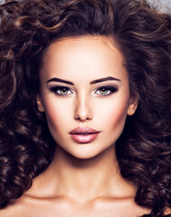 Woman with long bown curly hair