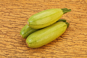 Young tasty zucchini over board