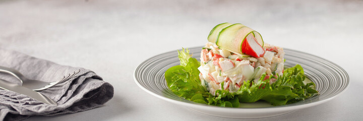 Salad of crab sticks, cucumbers, eggs and corn. Russian festive food © murziknata