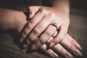 beautiful diamond engagement ring on the finger holding hands