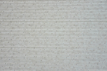 Cream brick wall texture background. Tiled. Horizontal