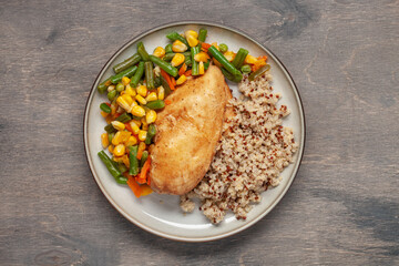 Diet lunch - chicken breast with quinoa and  vegetables .  Top view