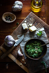 pesto sauce in a bowl , cooking. ingredients parmesan, garlic olive oil, pine nuts