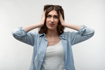 Beautiful young woman in distress looking worried and desperate. Stress and mental health