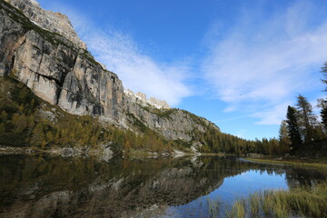 Fototapeta na wymiar Autumn in the Dolomites, view of Federa lake surrounded by mountains