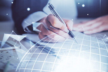 Multi exposure of hands making notes with world map hologram and data theme icons. Concept of global computer data.