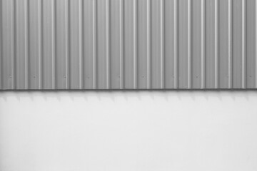 Corrugated metal panel cladding of a warehouse building