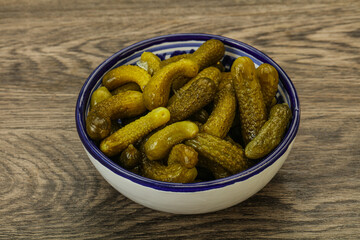 Pickled gherkin in the bowl