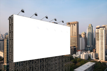 Blank white road billboard with Bangkok cityscape background at sunset. Street advertising poster, mock up, 3D rendering. Side view. The concept of marketing communication to promote or sell idea. © VideoFlow
