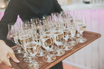 first toast of the bride and groom with a glass of champagne.