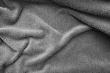 Warm wavy grey plaid on bed, top view  © Savvapanf Photo ©
