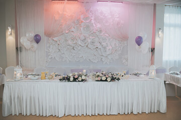 Beautifully decorated wedding table and other details at wedding hall. Wedding day.