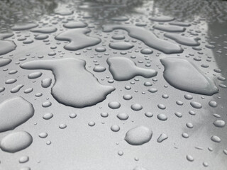 Fototapeta na wymiar Water rain drops on floor ground, Raindrops on white background.