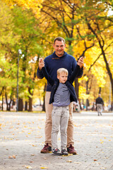 Obraz premium Blonde little boy in autumn park