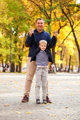 Fototapeta premium Blonde little boy in autumn park