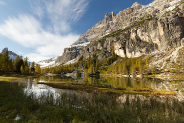 Autumn in the Dolomites, view of Federa lake surrounded by mountains