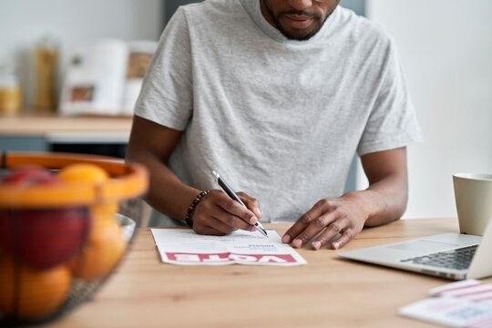 Black man voting from home