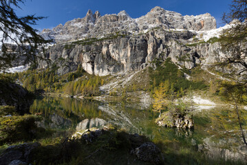 Autumn in the Dolomites, view of Federa lake surrounded by mountains