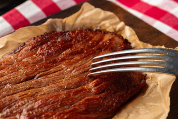 Grilled beef steak served on plate close up