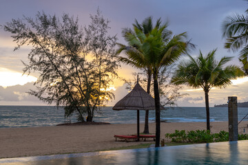 Beautiful sunset on the swimming pool with seaview