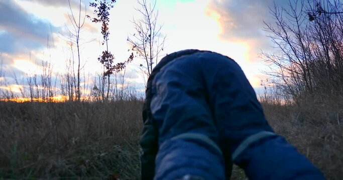 Running Child Falls Down and Ground And Gets up. Brave Boy. Winter Autumn Evening Field