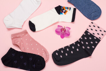 Color women socks on a pink background.