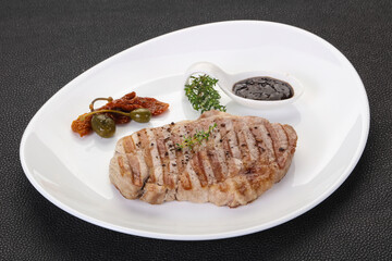 Grilled pork steak with pepper sauce