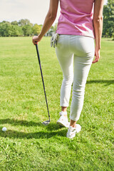 Professional female athlete standing on the course