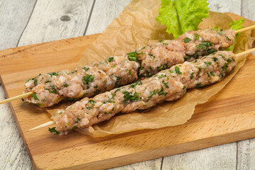 Raw minced pork skewer kebab for grill