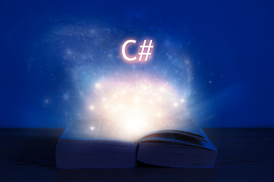 Open book with c# inscription. Light coming from open book with words c sharp.