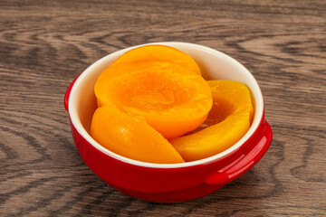 Marinated peaches fruit in the bowl