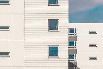 Modern Residential Building in Oslo, Norway.
Façade Detail with Square and Rectangular Window Frames. Architectural Photography. Minimal Aesthetics.  Repetition, Pattern and Rhythm in Architecture.