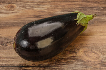 Black ripe fresh eggplant over background