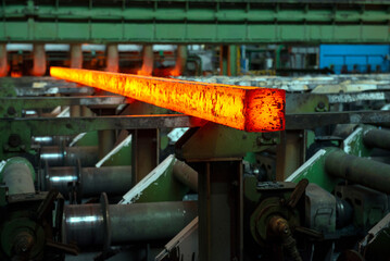 Steel production in electric furnaces. Sparks of molten steel. Electric arc furnace shop ....