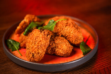 Fried chicken nuggets on red background 