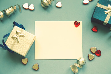 mock up greeting paper note on a blue vintage background, DIY greeting design, gift boxes - 386616516