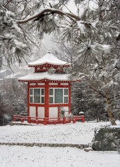 Japanese style little building in the garden on a snowy day